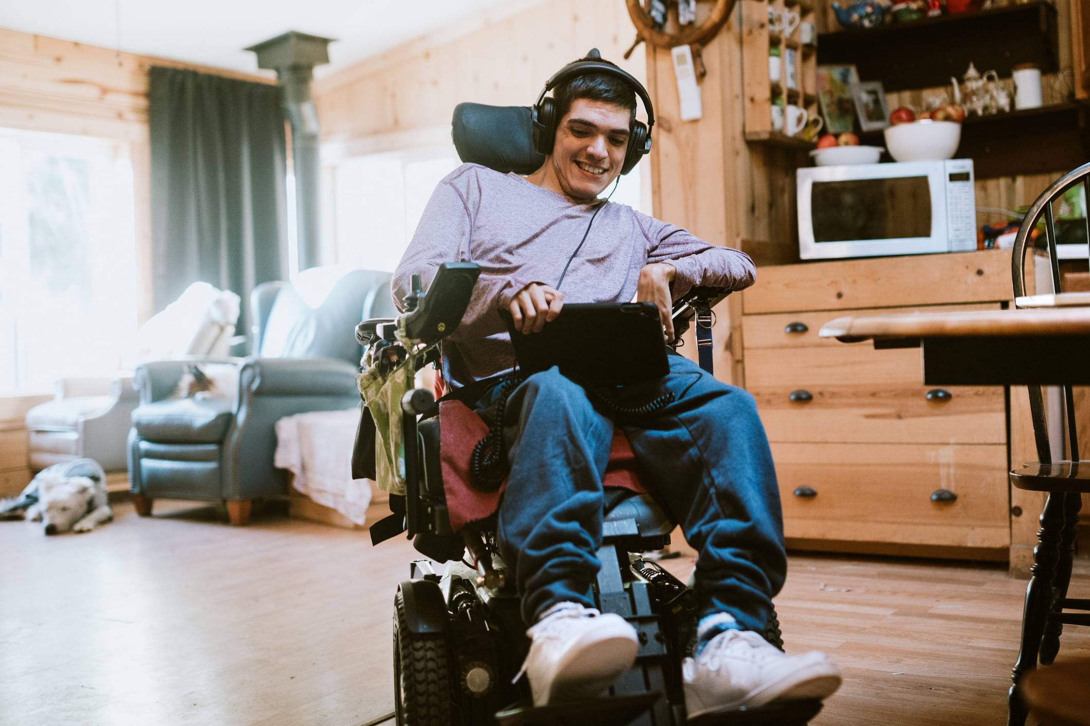 Confident Young Man In Wheelchair At Home