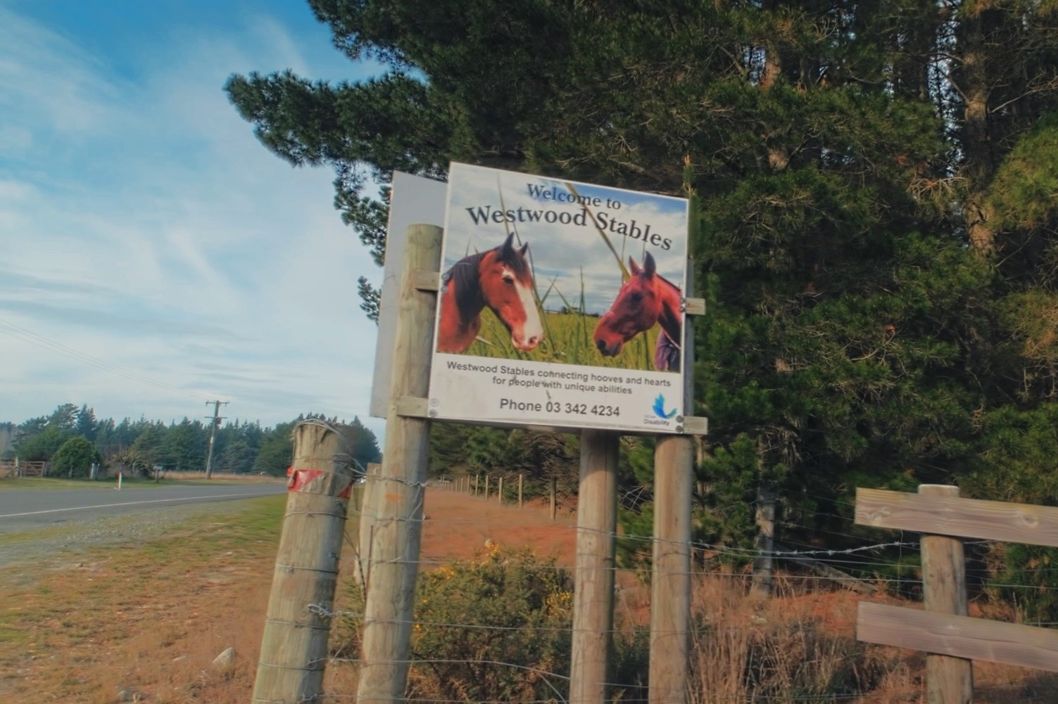 The sign for Westwood Stables
